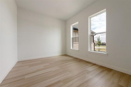 Unfurnished room with light hardwood / wood-style floors