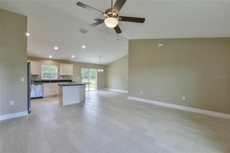 Living area view of kitchen and dining area