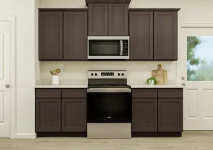 Rendering of the Reed floor plan's
  kitchen featuring wood cabinetry and stainless steel appliances.