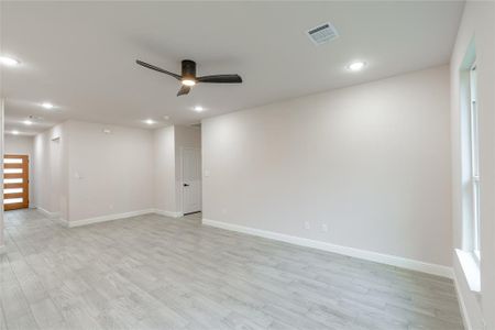 Foyer entrance featuring light wood-type flooring leading into the living room