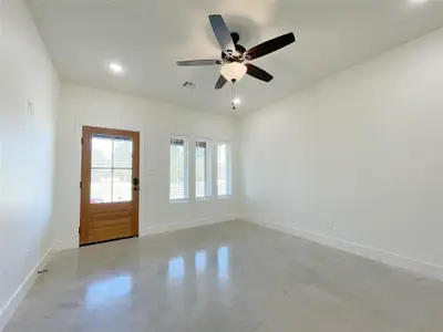 Unfurnished room featuring ceiling fan