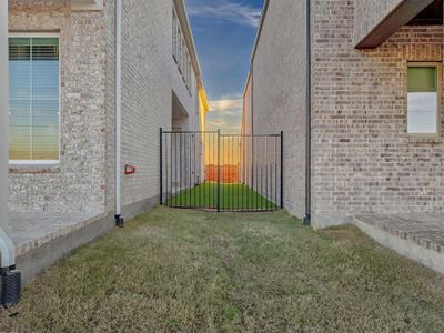 Property exterior at dusk featuring a yard