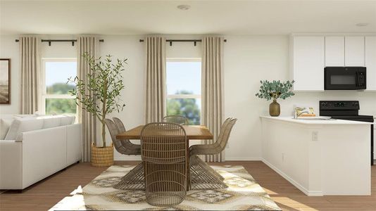 Dining area featuring light wood-type flooring, a wealth of natural light, and sink