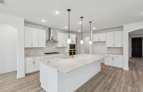 Spacious kitchen with oversized kitchen *real home pictured