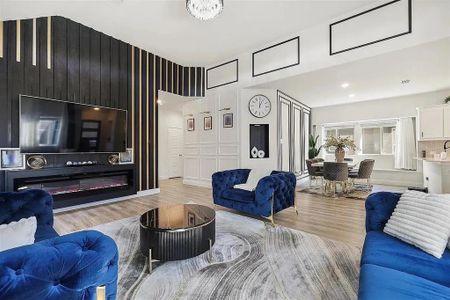 Living room with light hardwood / wood-style floors