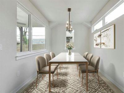 A stunning chandelier adds a touch of elegance and sophistication to the dining space, making it a focal point for gatherings. *Virtually Staged*