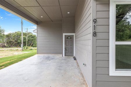 View of carport and front door