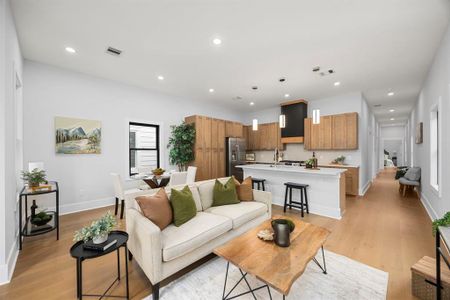 Designed and built to meet City of Houston Historic Guidelines. Features an open-concept layout with a seamless flow between the living, dining, and kitchen areas. The space boasts high ceilings, recessed lighting, and elegant floors.