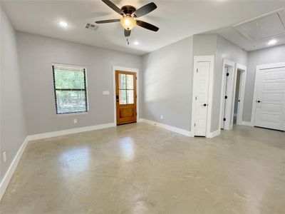 Empty room featuring ceiling fan