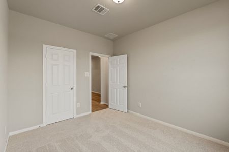 An additional view of the secondary bedroom and closet.