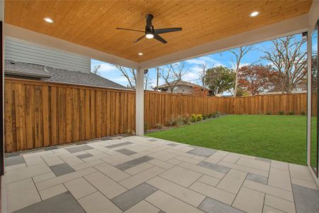 View of patio featuring ceiling fan