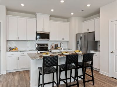 Gather the family around the kitchen island while cooking dinners.