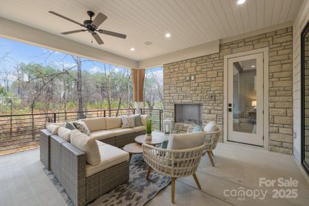 Back porch with gas fireplace and custom rails