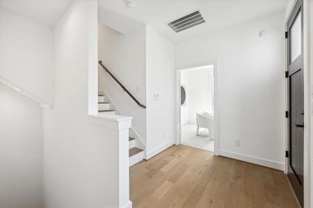 Bedroom to your right, clean white paint brightens this home.