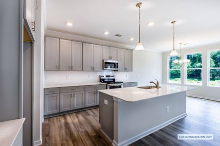 Representative photo of the Melton plan chef-inspired kitchen with quartz countertops.