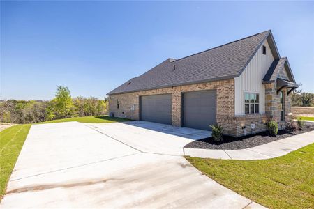 View of side of property featuring a garage