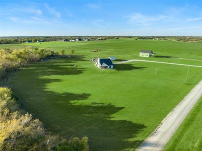 Birds eye view of property featuring a rural view