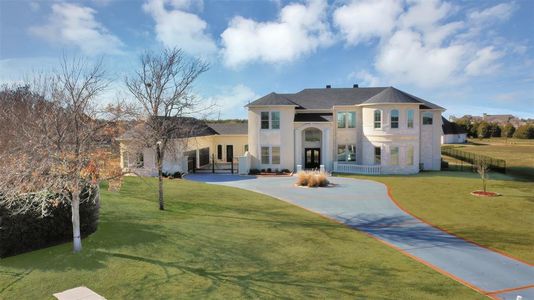 Mediterranean / spanish-style house featuring a front yard