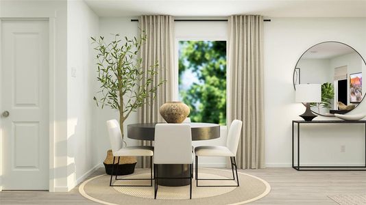 Dining space with light hardwood / wood-style floors