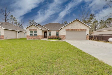 Double-wide driveway providing ample parking space for multiple vehicles, perfect for family and guests.