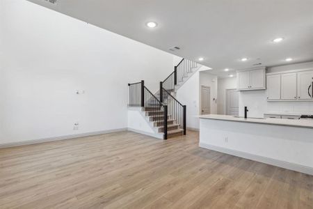 Open metal railing on your new staircase continues the open and airy felling upstairs.