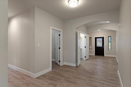 Entrance foyer with light wood-type flooring