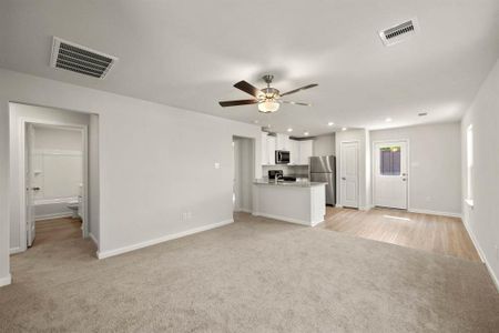 Spacious living room, open to the kitchen and dining area.