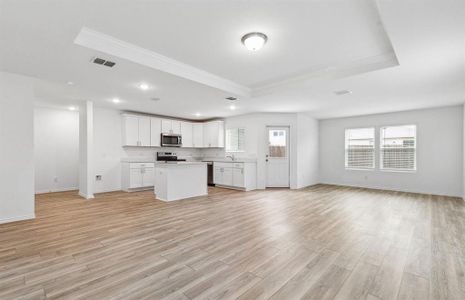 Gathering room drenched in natural light, creating a warm atmosphere *Real home pictured