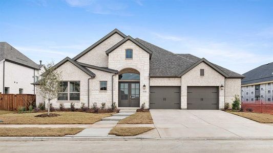 French country style house with french doors and a garage