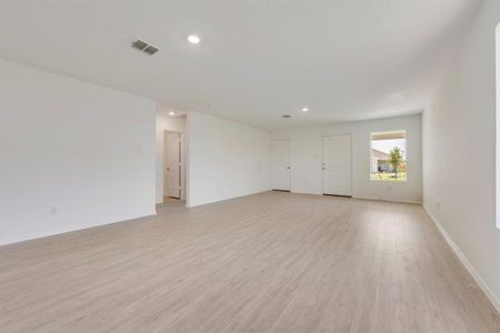 Spare room featuring light wood-type flooring