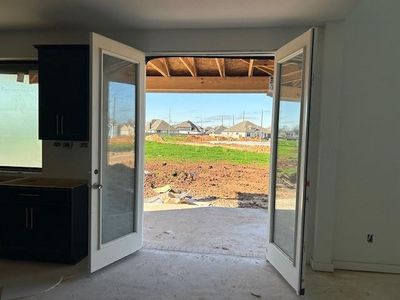 Double doors lead to the patio.