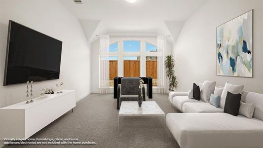 Living room featuring light carpet and a towering ceiling