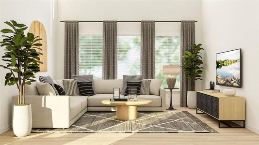 Living area with light hardwood / wood-style floors and a healthy amount of sunlight