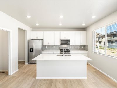 Kitchen in the Wateron floorplan at a Meritage Homes community in Brighton, CO.