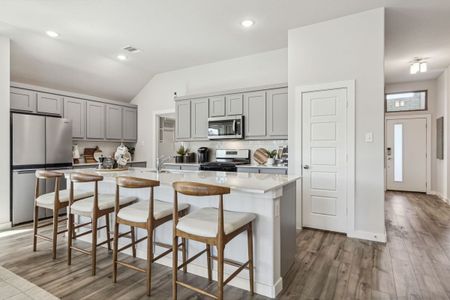 Kitchen in the Diamond home plan by Trophy Signature Homes