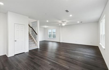 Bright gathering room with large windows*real home pictured