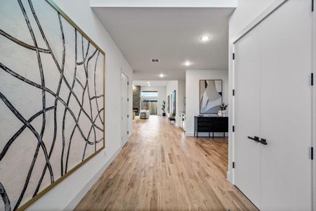 Hall featuring light hardwood / wood-style flooring