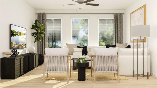 Sitting room featuring ceiling fan and light wood-type flooring