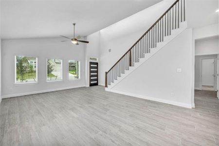 Large 8' front door and wrought iron railing on the stairs.