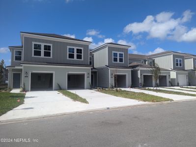 New construction Townhouse house 14491 Macadamia Lane, Unit 317, Jacksonville, FL 32218 - photo 0