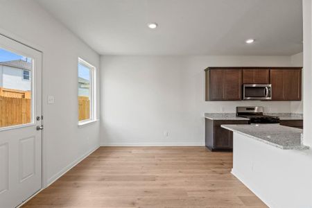 Dining room with light wood-style flooring