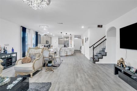 Living room with light hardwood / wood-style flooring