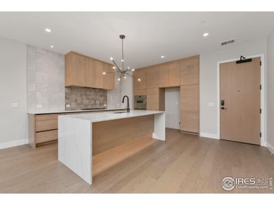 Beautiful waterfall style marbled quartz kitchen island