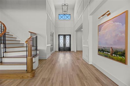 There is a custom feel the moment you step inside. Inlayed wood flooring, soaring ceilings, custom molding... this is luxury waiting.