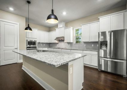 Kitchen with granite countertops and stainless steel appliances.