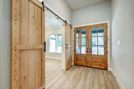 Whether it's for guests arriving for the first time or for the homeowners returning at the end of the day, stepping through this doorway is sure to evoke a sense of pride and joy.