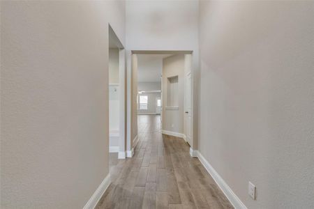 Hallway featuring light wood-type flooring