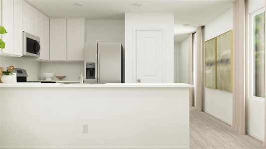 Kitchen featuring sink, refrigerator with ice dispenser, stove, white cabinets, and light wood-type flooring