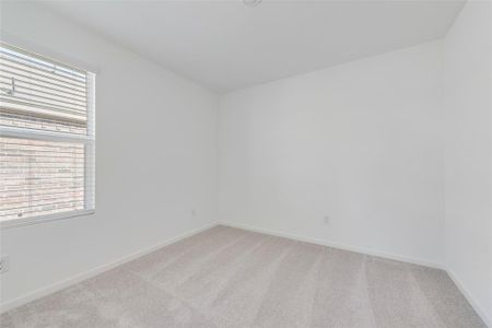 Unfurnished room with light colored carpet