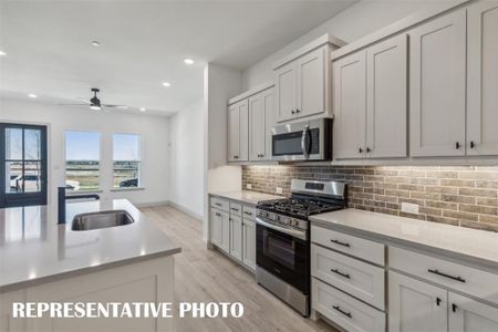 Featuring beautiful finishes and a thoughtful layout, all the chefs in the family will love this fantastic kitchen!  REPRESENTATIVE PHOTO